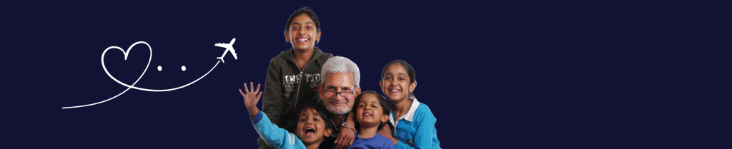 A joyful Indian family hugging each other at the airport, celebrating their reunion because Gaura is Back operating flights from India to Australia.
