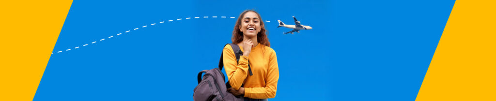 A happy international student safely holding her passport and a cheap student flight ticket, ready to travel comfortably from Australia to India.