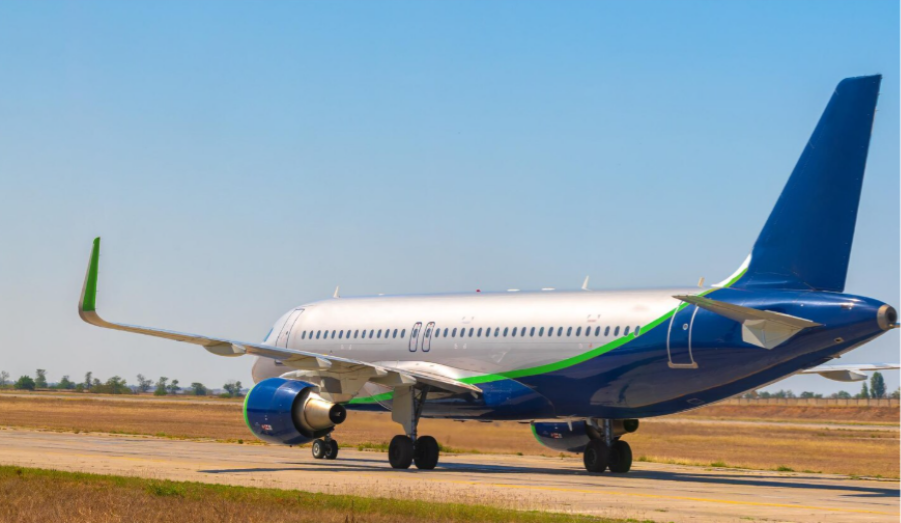 An airplane mid takeoff on the runway